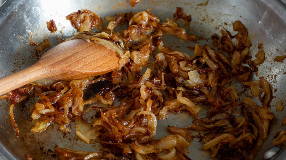 Prepare the onions and bacon for quiche