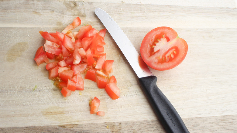 diced tomatoes on cutting board