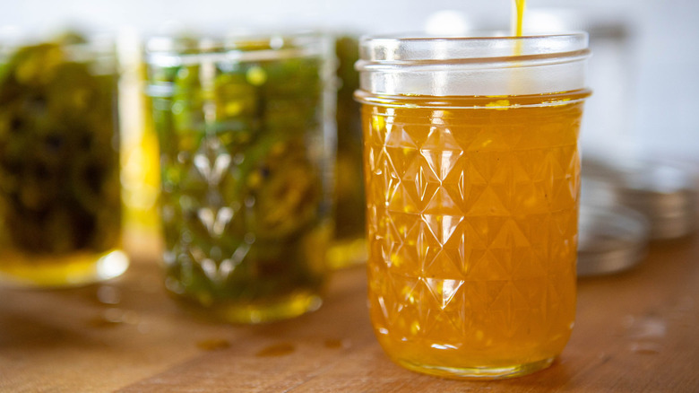 liquid pouring into a jar