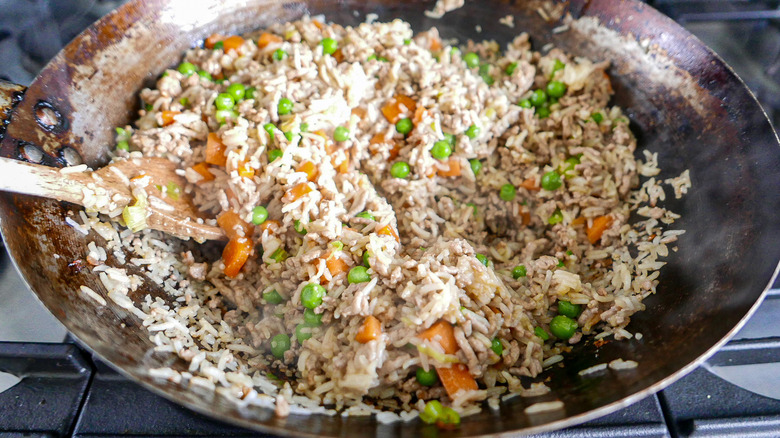 carrots and pork mince in wok 