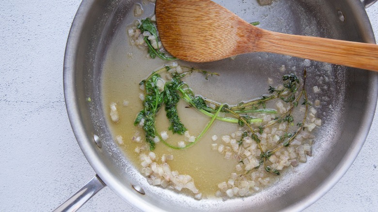 butter and herbs in pan