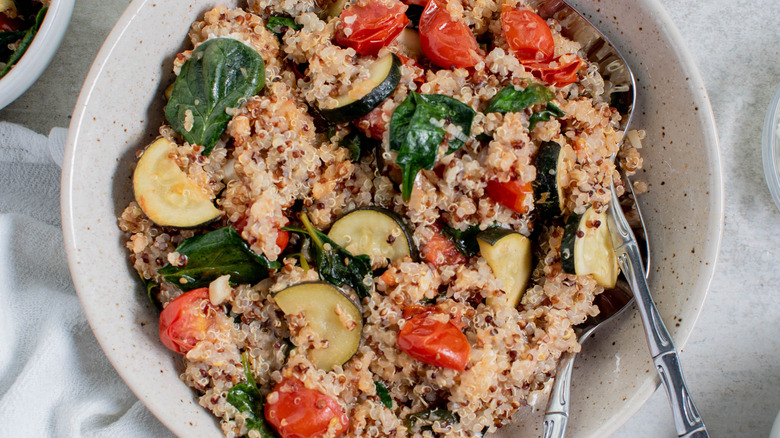 a bowl of quinoa zucchini salad