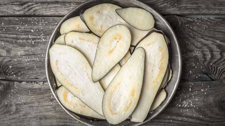 sliced eggplant on metal plate