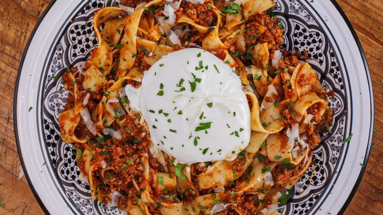 pasta with ragu sauce burrata