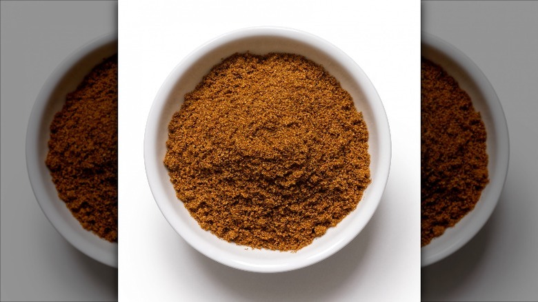 A bowl of ground cumin