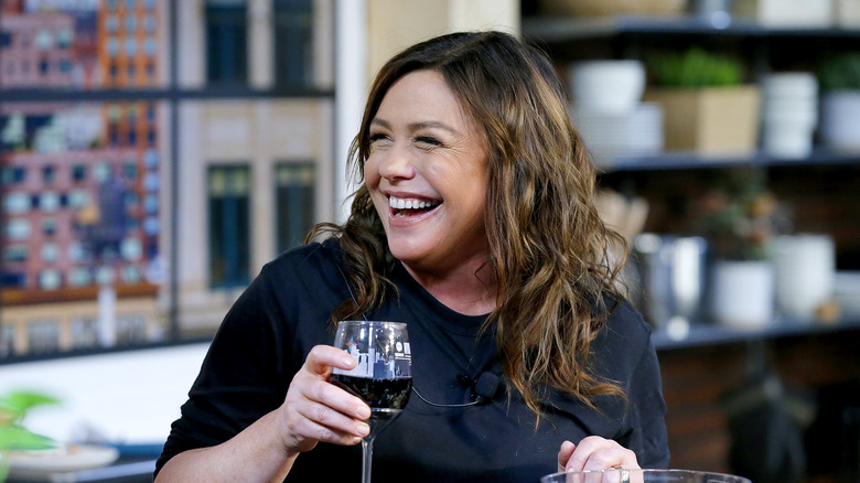 Rachael Ray holding glass of wine