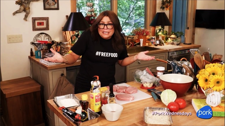 Rachael Ray shrugging in her kitchen