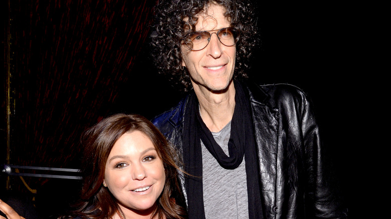 surprise celebrity friends Rachael Ray and Howard Stern pose together