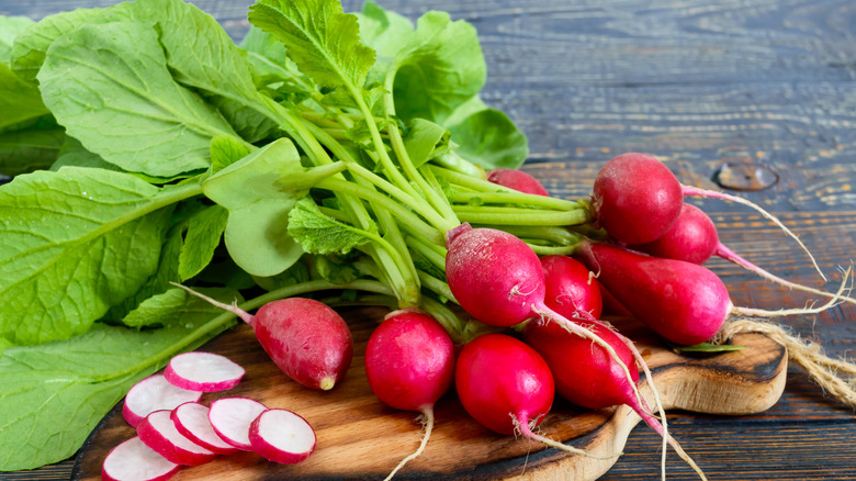 Radishes and greens on board