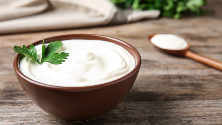 Bowl of sour cream with garnish 