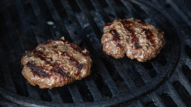 cooked burgers on a grill