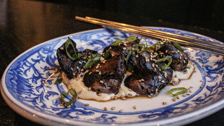 Wood-fired duck hearts