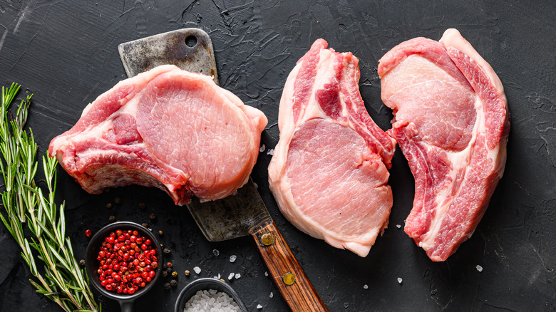 Raw pork chops with spices