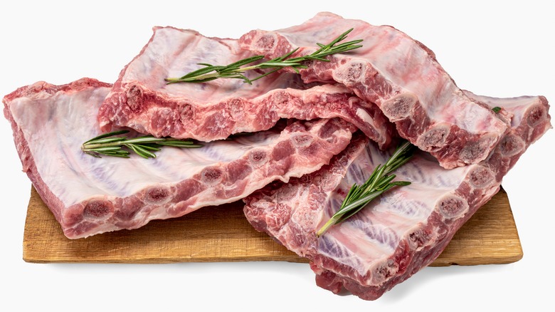 Raw pork ribs with rosemary