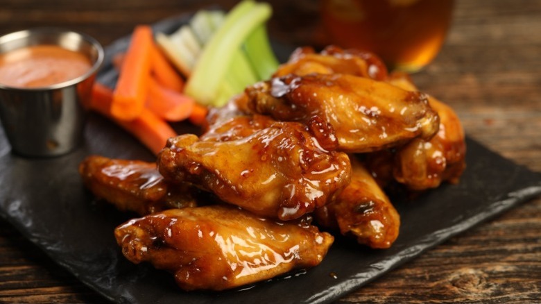 Firebelly Wings on plate with carrots and celery