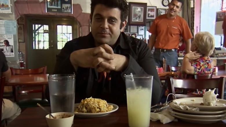 Adam Richman getting defeated by the El Taco Grande Challenge