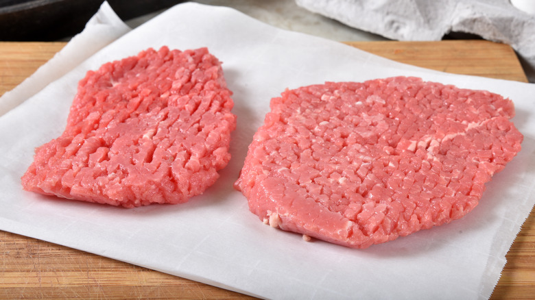 Cube steaks on parchment paper