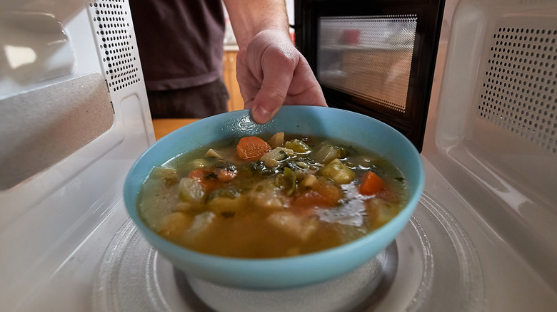 Bowl of soup in microwave