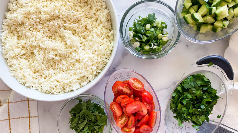 fresh tabbouleh ingredients in bowls