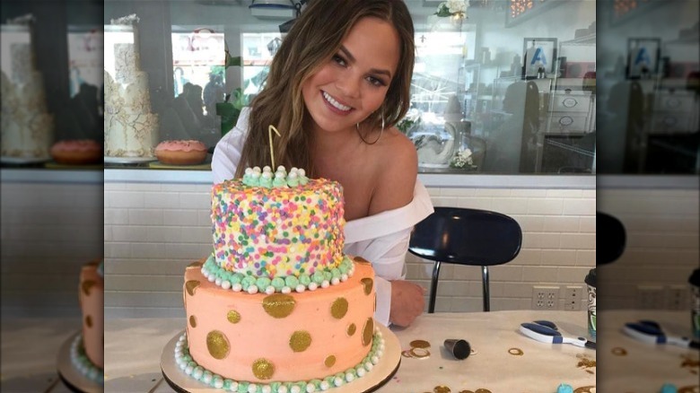 Chrissy Teigen with cake