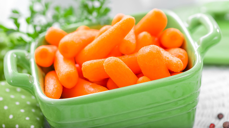 baby carrots in green container