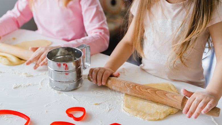 Rolling dough for heart-shaped cookies