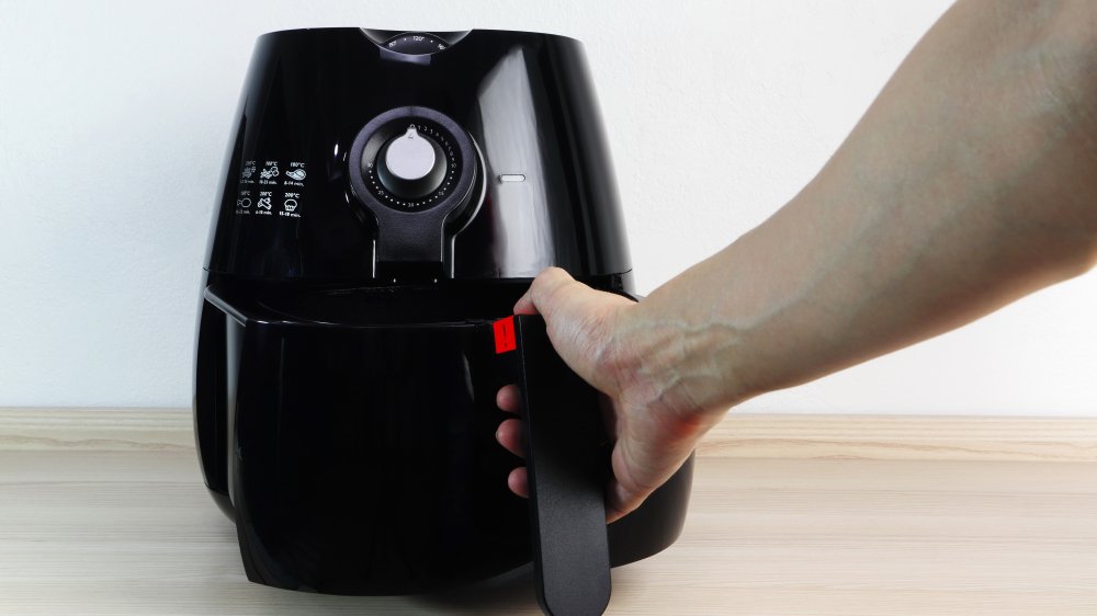 A representational image of cooking with an air fryer