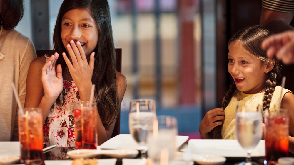 Customers at a hibachi restaurant