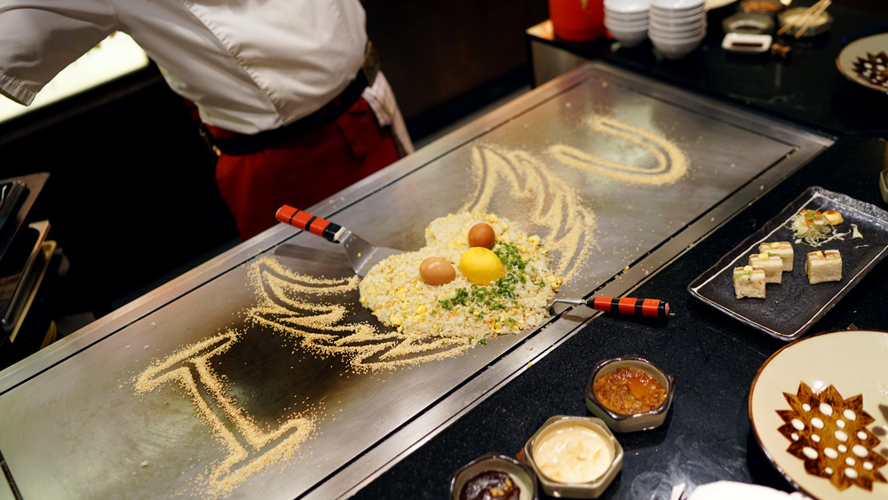 Hibachi grill at restaurant with chef