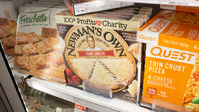 Display of frozen pizzas at grocery store