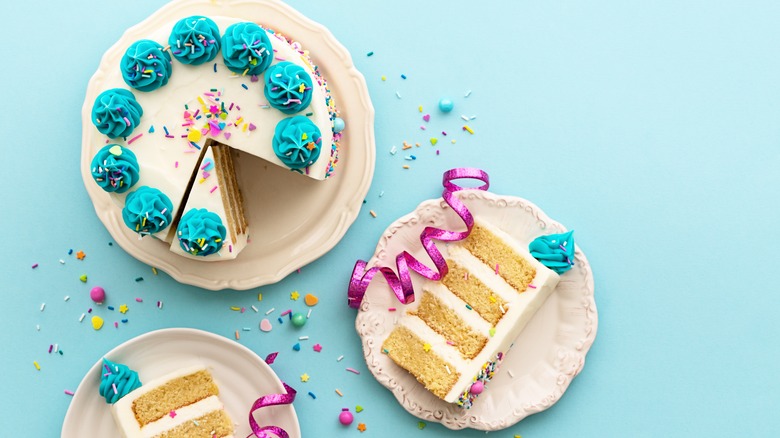 A birthday cake and slices 