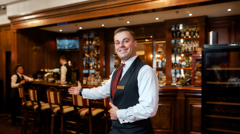 waiter greeting steakhouse employee