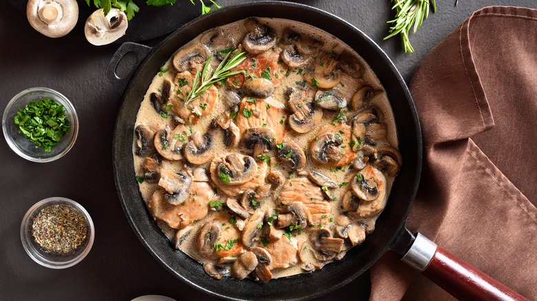 skillet with mushrooms in sauce