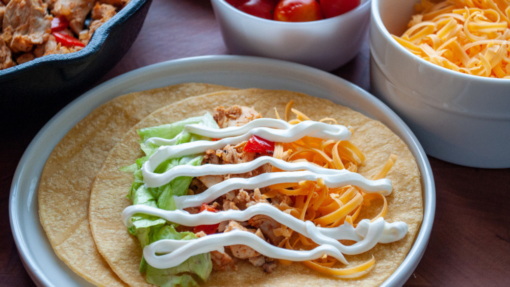 Taco with white sauce on a plate