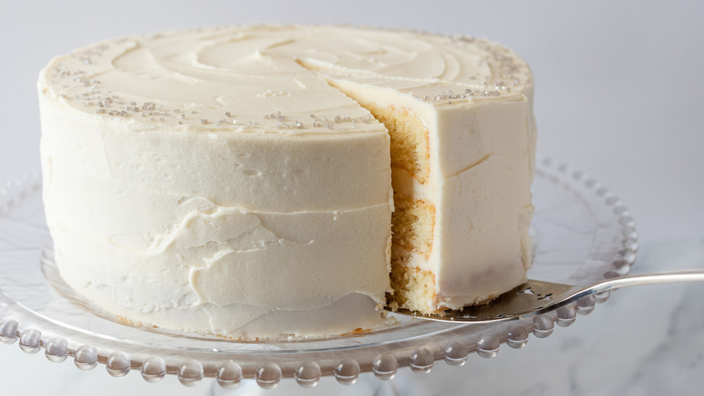 vanilla cake on pedestal