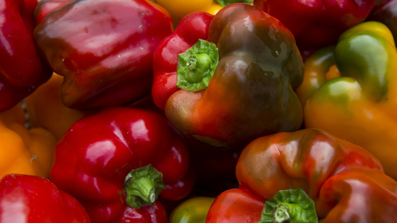 Closeup of a pile of red bell peppers