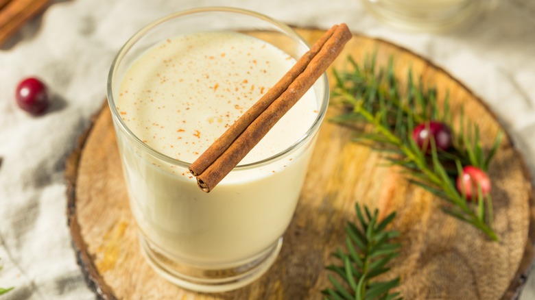 Creamy holiday cocktail with cinnamon stick