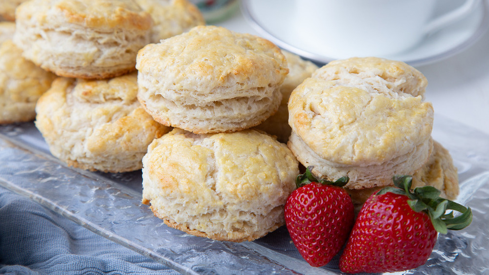 Homemade British scones with strawberries on a tray
