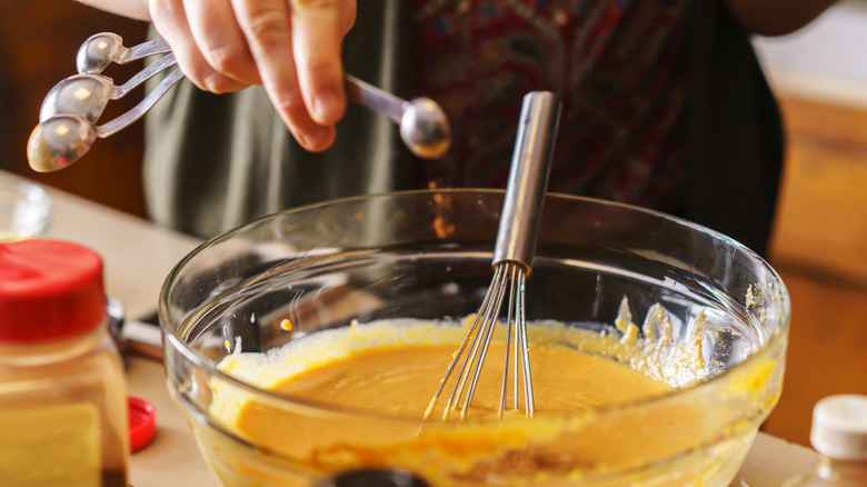 Measuring spoons over batter bowl