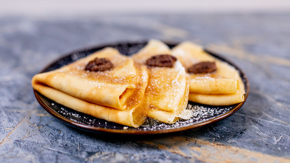 folded crepes on a plate