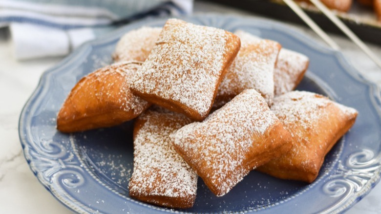 beignets on blue plate