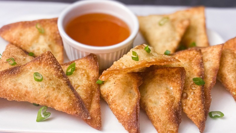 crab rangoon on white plate