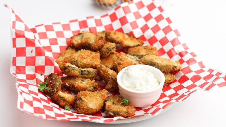 fried pickles on checked paper