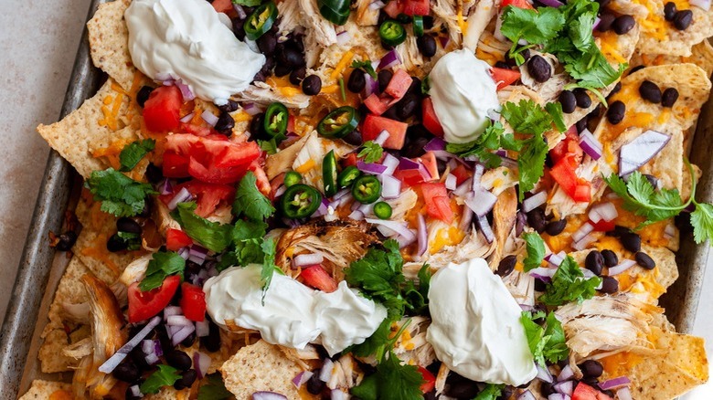 pan of nachos with toppings