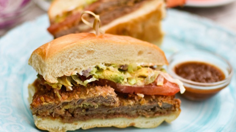 fried steak sandwich with salsa