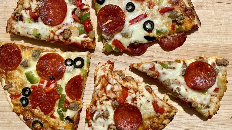 Slices of Tombstone and Red Baron supreme pizzas