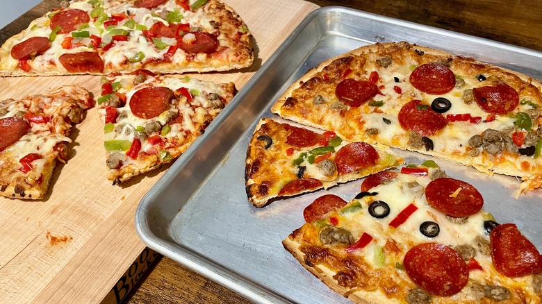 Two frozen supreme pizzas during the tasting