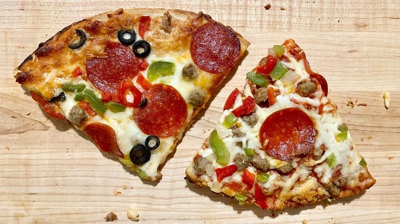 One serving of a Tombstone supreme pizza and a Red Baron supreme pizza