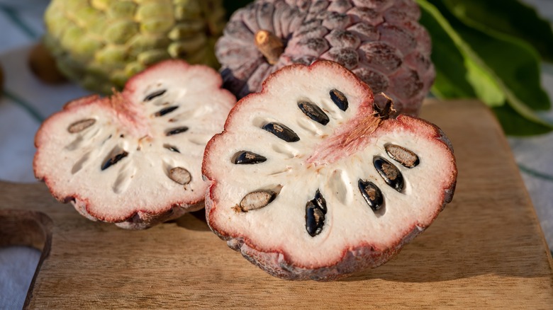 Red custard apple, halved