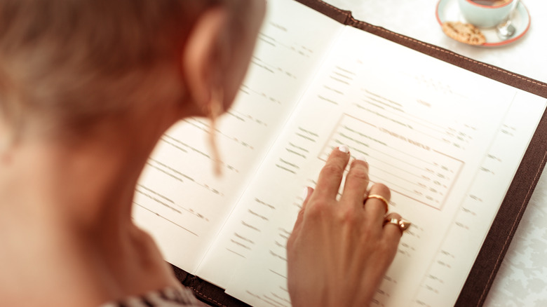 woman reading menu